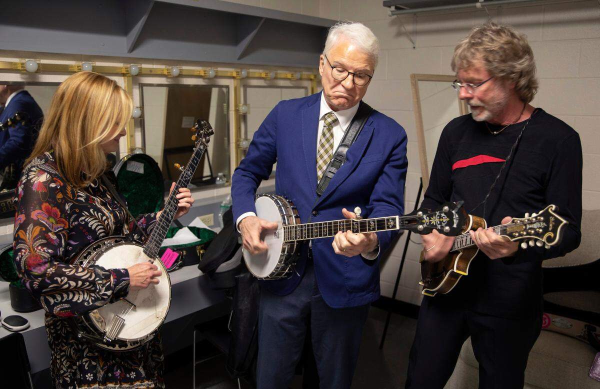 Steve Martin, center, works through a song with banjo player Alison Brown, left, and Mandolin player Sam Bush in their dressing room at the IBMA 2023 World of Bluegrass Music Awards in Raleigh, N.C., Thursday night, Sept. 28, 2023.