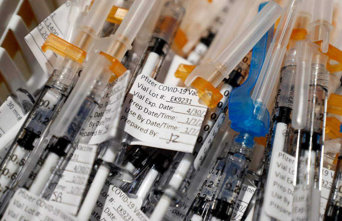Syringes with Pfizer’s COVID-19 vaccine are ready to be administered during a COVID vaccine clinic for employees at UNC REX Healthcare at UNC Rex Hospital in Raleigh, N.C., Thursday, January 7, 2021.
