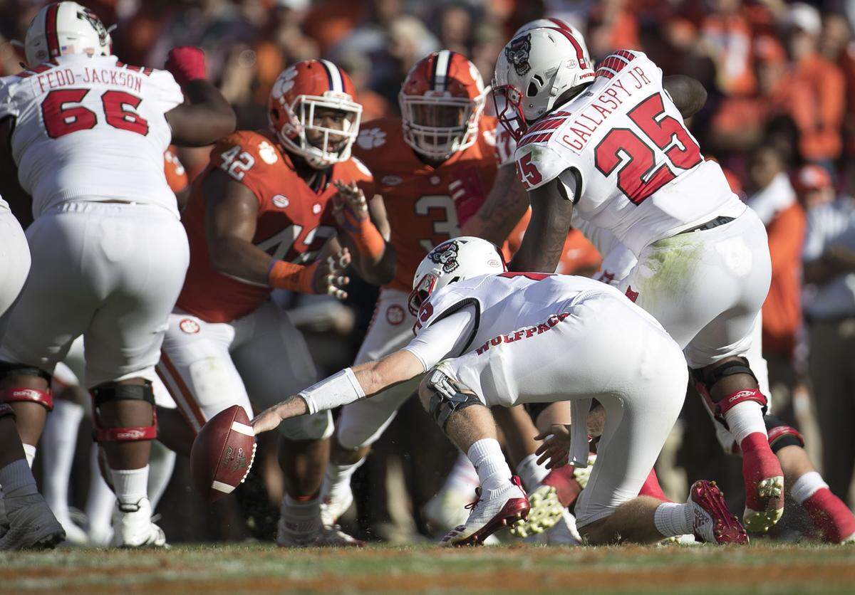 N.C. State quarterback Ryan Finley (15) fumbles the ball in the second quarter. Clemson’s Dexter Lawrence recovered the fumble late in the second quarter on Saturday, October 20, 2018 at Memorial Stadium in Clemson, S.C.