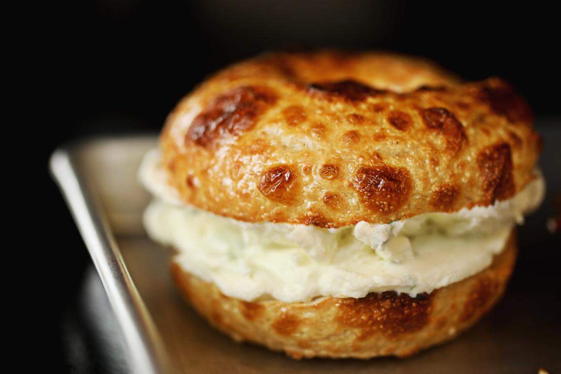 The asiago bagel is paired here with a scallion schmear at Big Dom’s Bagel Shop in Cary. 