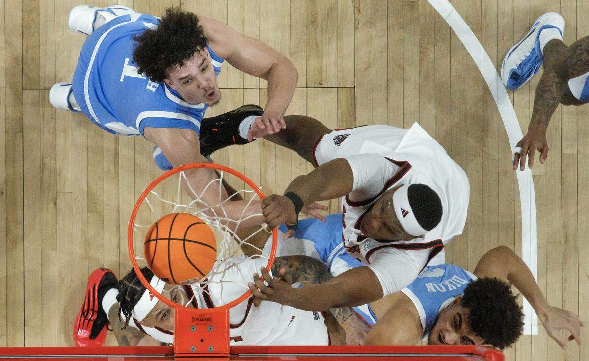  N.C. State’s Ven-Allen Lubin slams in two during the first half of the Wolfpack’s 82-58 win over North Carolina on Tuesday, Feb. 17, 2026, at Lenovo Center in Raleigh, N.C.