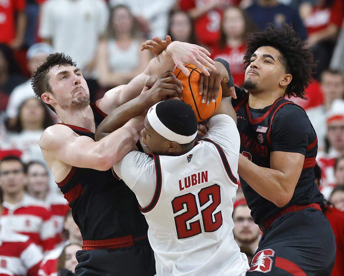 N.C. State's Ven-Allen Lubin battles Stanford's AJ Rohosy and Stanford's Donavin Young for a rebound during the second half of the Wolfpack’s 85-84 loss on Saturday, March 7, 2026, at Lenovo Center in Raleigh, N.C.
