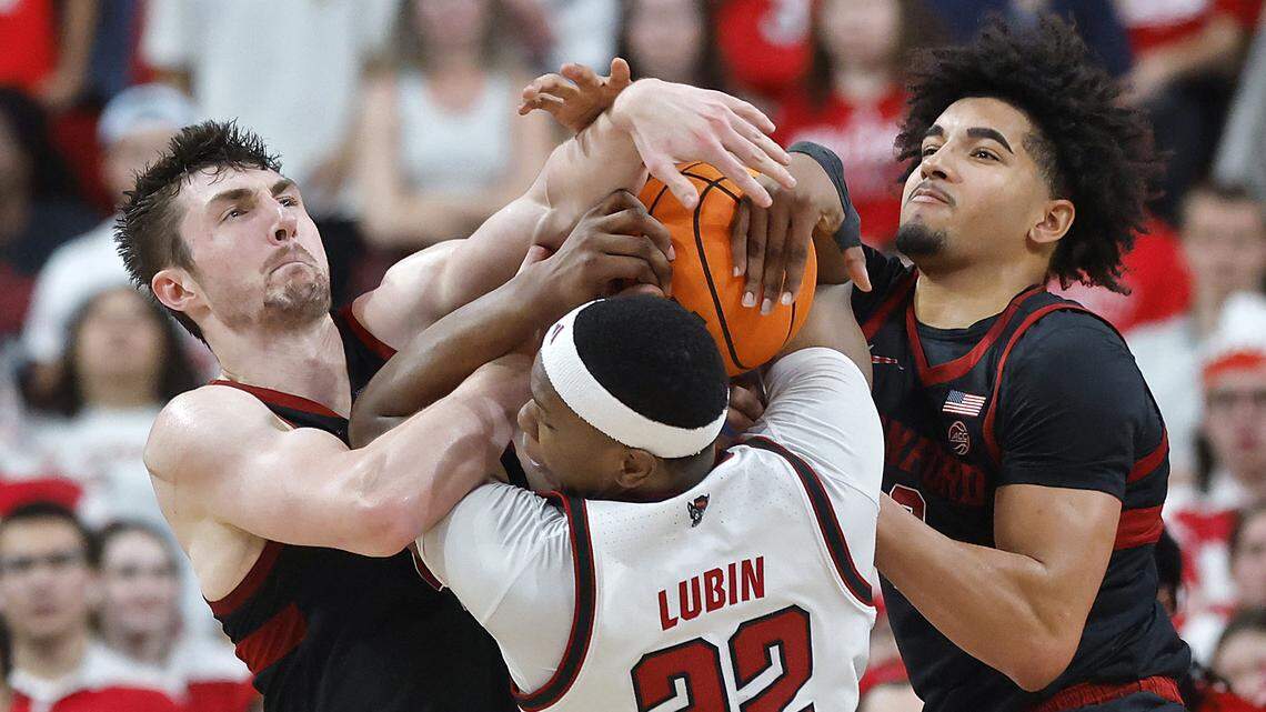 N.C. State's Ven-Allen Lubin battles Stanford's AJ Rohosy and Stanford's Donavin Young for a rebound during the second half of the Wolfpack’s 85-84 loss on Saturday, March 7, 2026, at Lenovo Center in Raleigh, N.C.