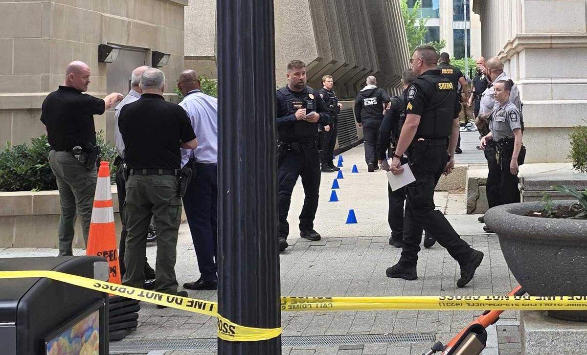 Raleigh police investigating the scene of a reported shooting on Fayetteville Street downtown May 22, 2026. Multiple suspects were in custody as of Friday morning, police said.