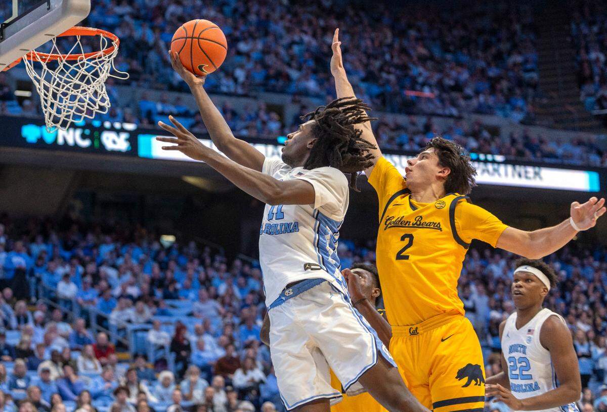 North Carolina guard Ian Jackson (11) breaks to the basket against Cal’s Andrej Stojakovic (2) in the second half on Wednesday, January 15, 2025 at the Smith Center in Chapel Hill, N.C. Jackson lead all scores with 20 points in the Tar Heels’ 79-53 victory.