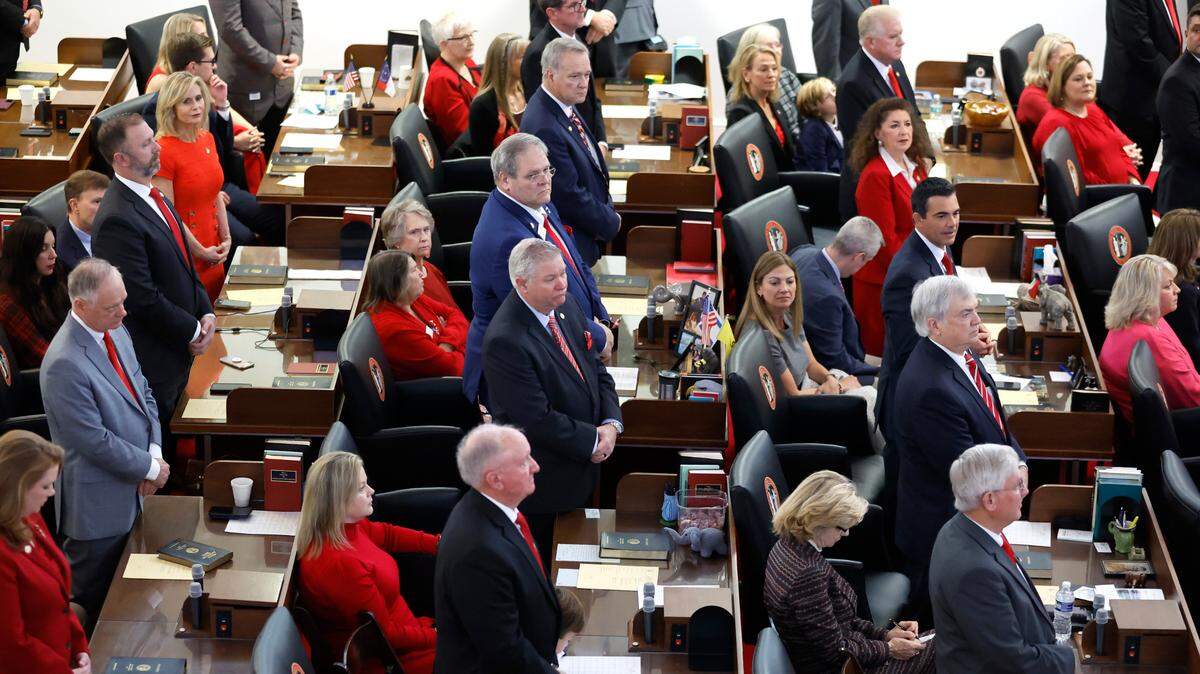 Members of the N.C. House of Representatives stand as their name is announced during the opening session of the N.C. House of Representatives Wednesday, Jan. 11, 2023.