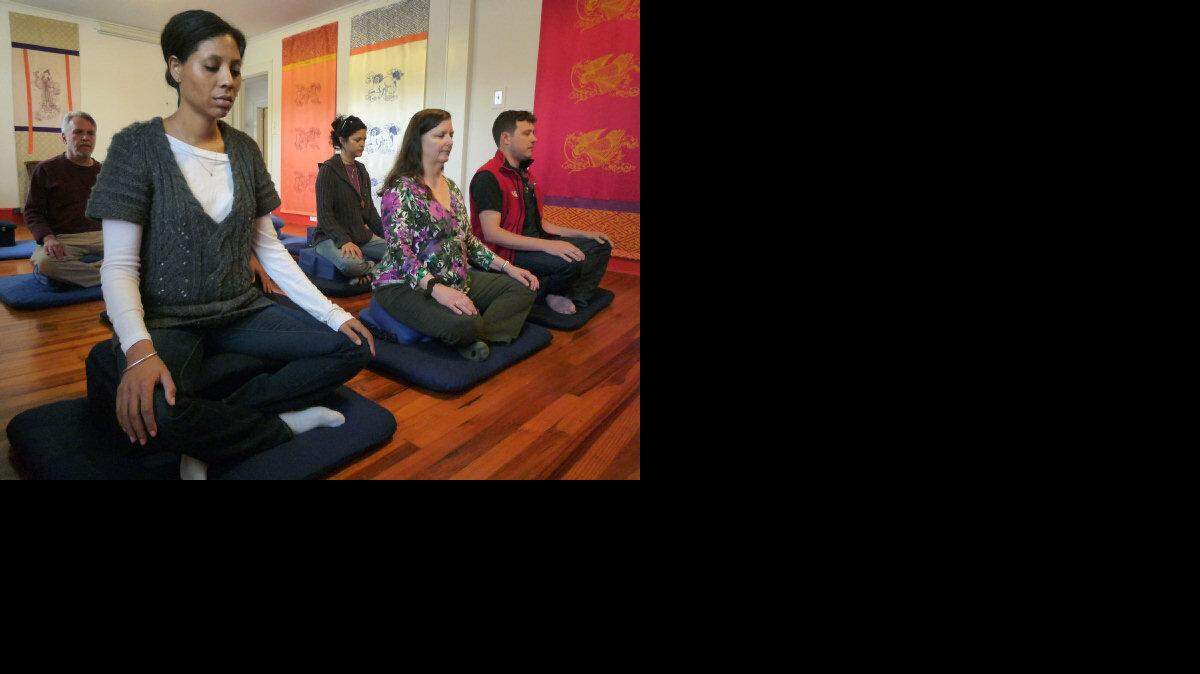 From left, David Uglow, Joy Mickle (foreground), Lindy Chicola, Wendy Farrell and Geoff Sutton meditate together at Durham Shambhala Center on Sunday (April 28). The center is eyeing expansion to accommodate the growing number of participants in recent years.