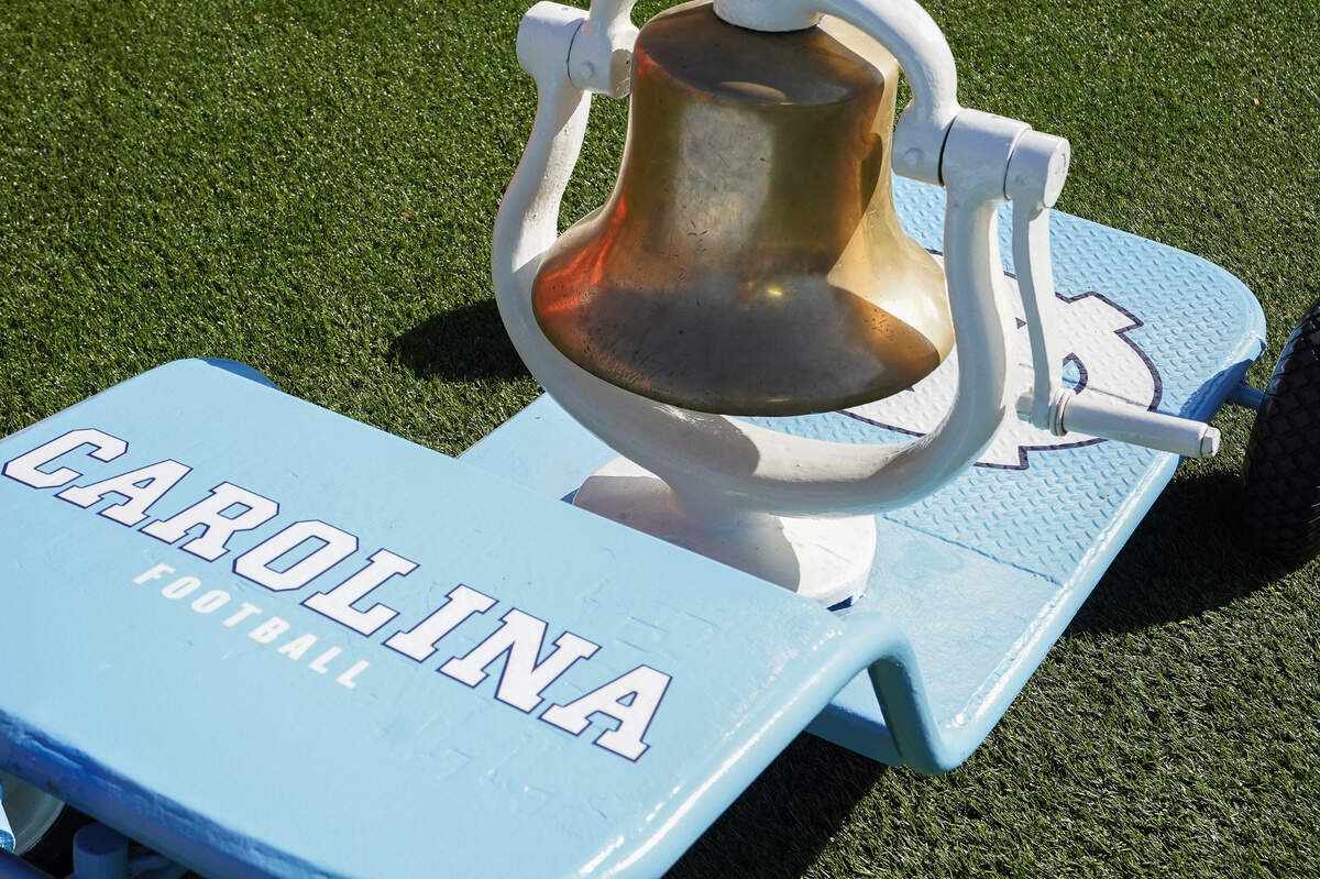 The victory bell is painted in the colors of the previous winning team and is at stake for the game between the Duke Blue Devils and the North Carolina Tar Heels at Wallace Wade Stadium.