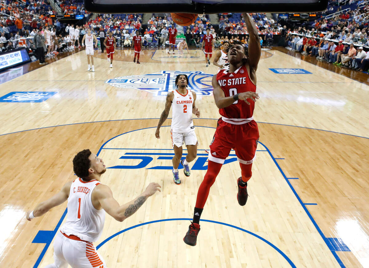 N.C. State’s Terquavion Smith (0) slams in two during Clemson’s 80-54 victory over N.C. State in the quarterfinals of the ACC Men’s Basketball Tournament in Greensboro, N.C., Thursday, March 9, 2023.