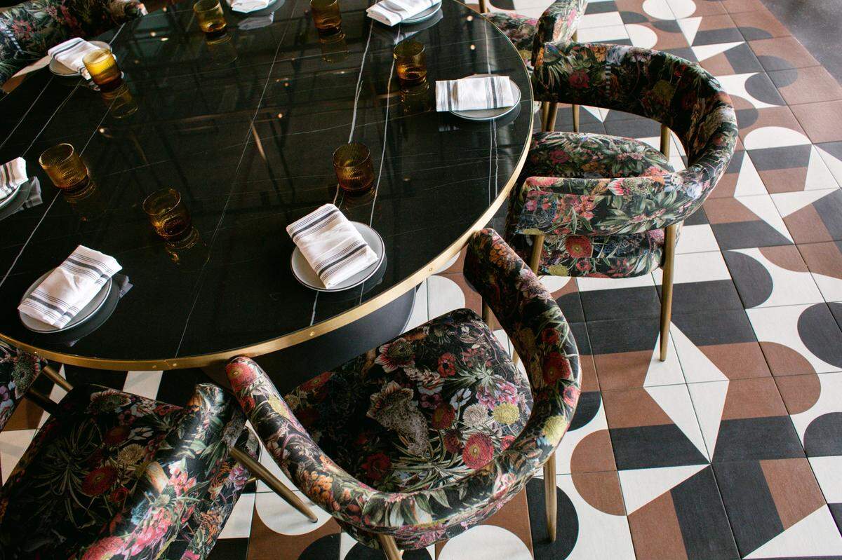 Look for bold florals in the sunlit dining room of The Lenny, downtown Durham’s newest and tallest restaurant.