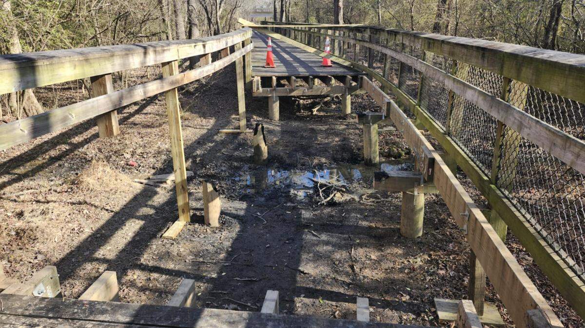 A fire destroyed part of a wooden bridge on the Walnut Creek Trail between mile marker 2.25 and 2.5.
