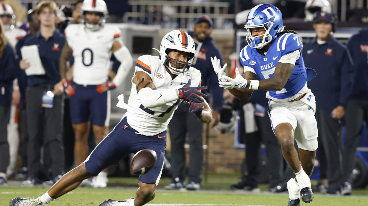 Virginia’s Devin Neal pressures an incomplete pass intended for Duke’s Que'Sean Brown during the second half of the Blue Devils’ 34-17 loss on Saturday, Nov. 15, 2025, at Wallace Wade Stadium in Durham, N.C.