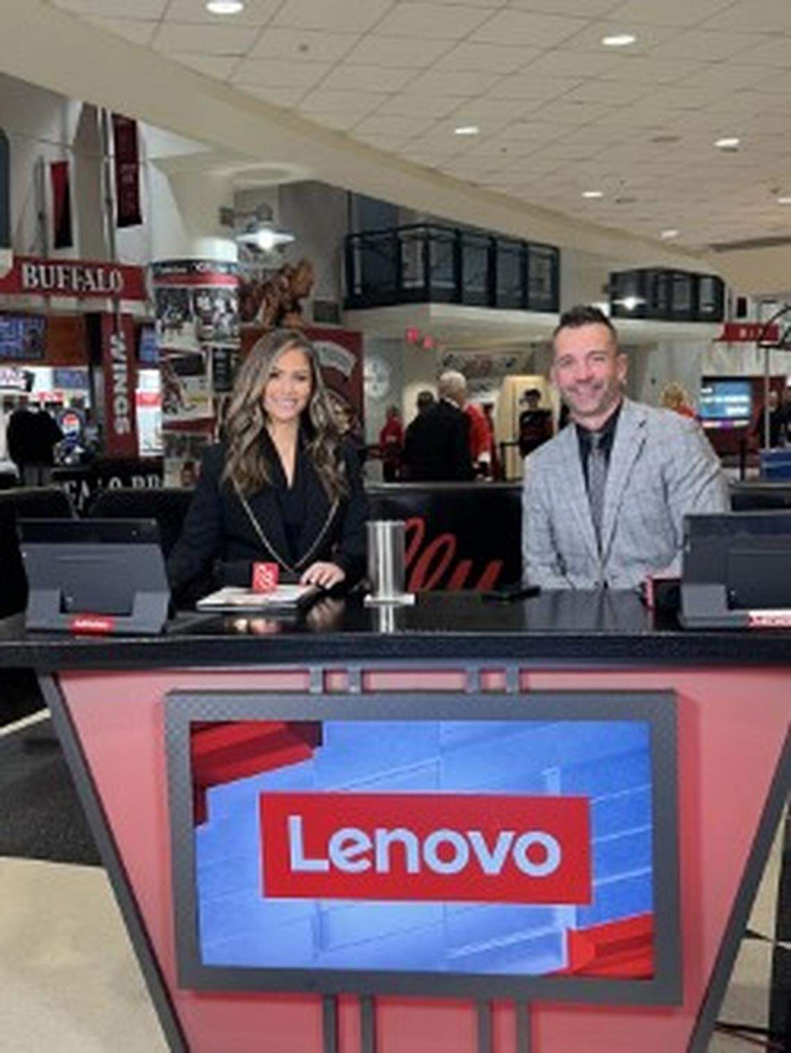 Hanna Yates on the set of the FanDuel Sports Network desk, alongside Hurricanes’ analyst Shane Willis, at the Lenovo Center in Raleigh.
