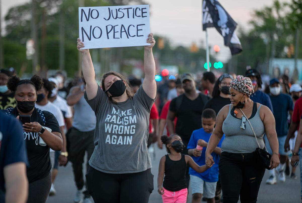 Demonstrators march along Hughes Blvd. on Wednesday, April 28, 2021 in Elizabeth City, N.C. This is the eighth day of demonstrations in the wake of Andrew Brown Jr.’s death at the hands of Pasquotank County deputies.
