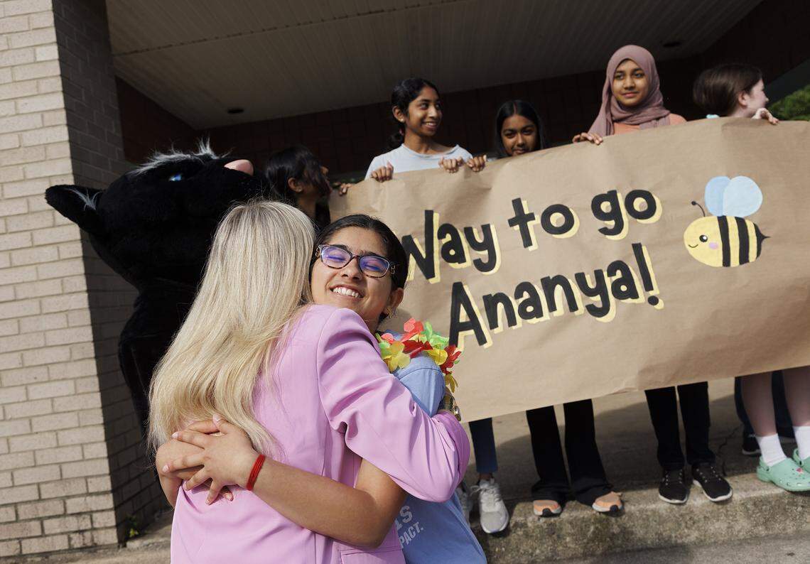 Davis Drive Middle School seventh-grader Ananya Rao Prassanna receives a hug from Assistant Principal Anna Best during a celebration on Monday, June 3, 2024, in Cary, honoring Prassanna’s third place finish in the Scripps National Spelling Bee. File photo.