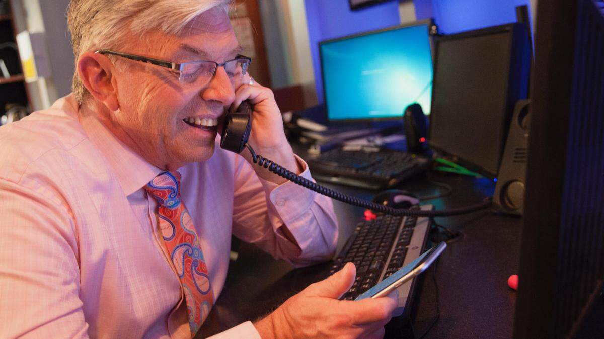 Greg Fishel gets ready for Thursday's newscasts on his first day back to work.