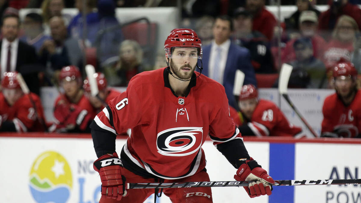 Carolina Hurricanes defenseman Joel Edmundson (6) watches during a faceoff during the second period of an NHL hockey game against the New York Rangers in Raleigh, N.C., Thursday, Nov. 7, 2019. (AP Photo/Gerry Broome)