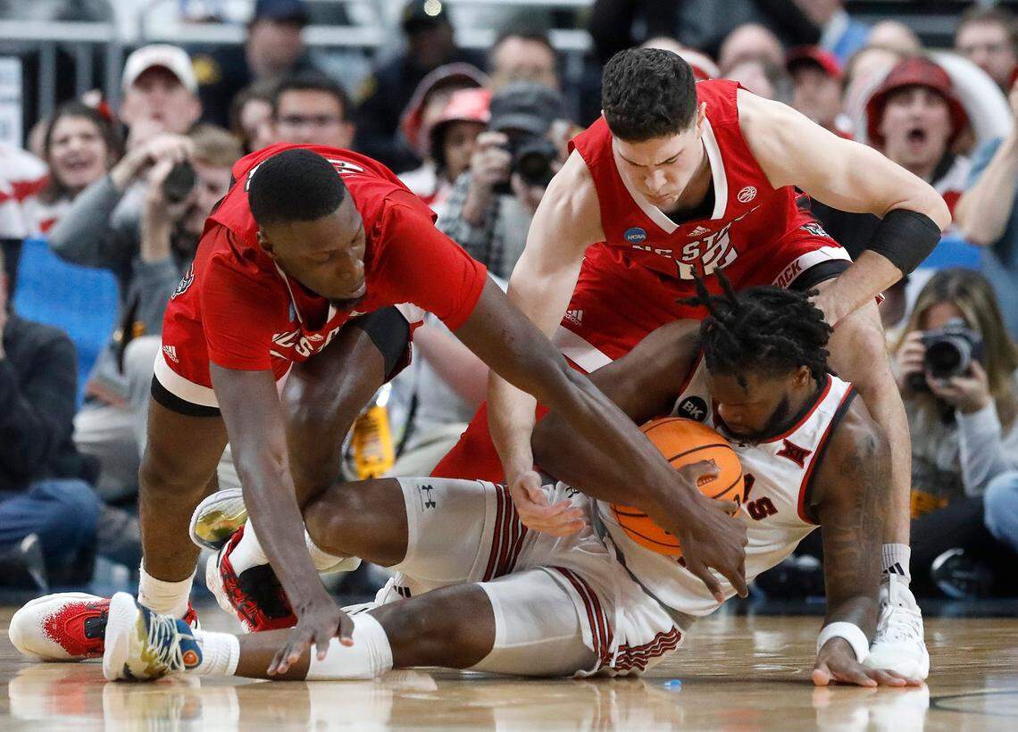 N.C. State’s Mohamed Diarra and Michael O’Connell tangle with Texas Tech’s Joe Toussaint during the first half of the Wolfpack’s 80-67 win in first round of the NCAA Tournament on Thursday, March 21, 2024, at PPG Paints Arena in Pittsburgh, Pa.