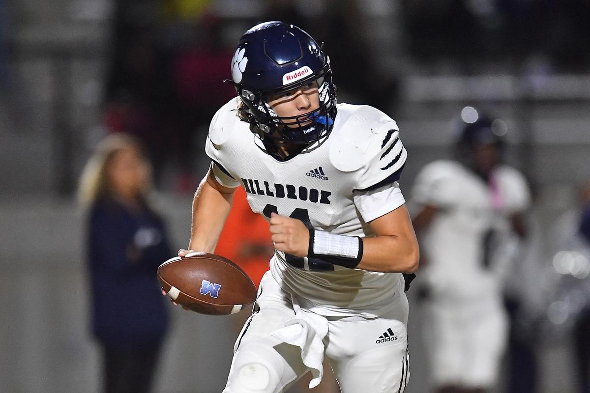 Millbrook quarterback Mason Fortune (11) looks to pass during the second half. The Wake Forest Cougars and the Millbrook Wildcats met in a football game in Wake Forest, N.C. on October 28, 2022.