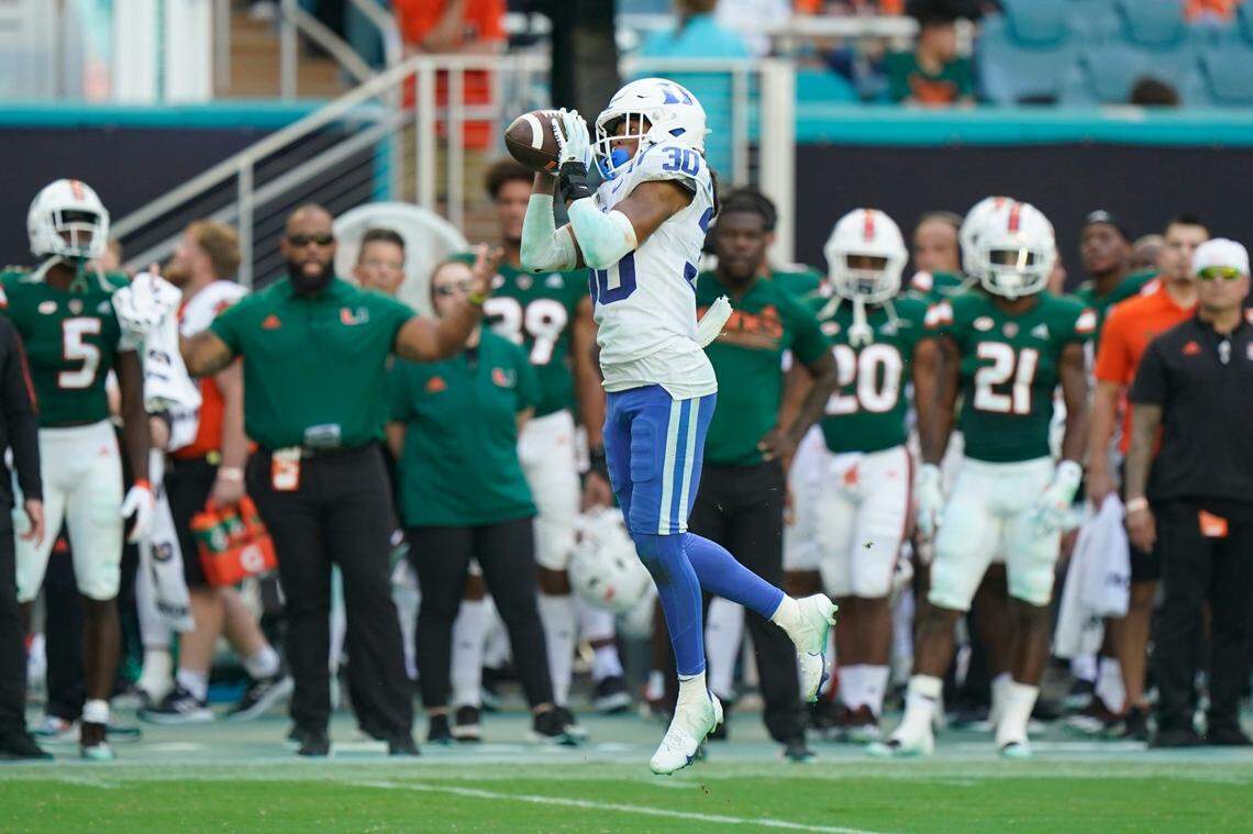 Duke defensive back Brandon Johnson intercepts a pass and runs it in for a touchdown during the second half of an NCAA college football game against Miami, Saturday, Oct. 22, 2022, in Miami Gardens, Fla. (AP Photo/Wilfredo Lee)
