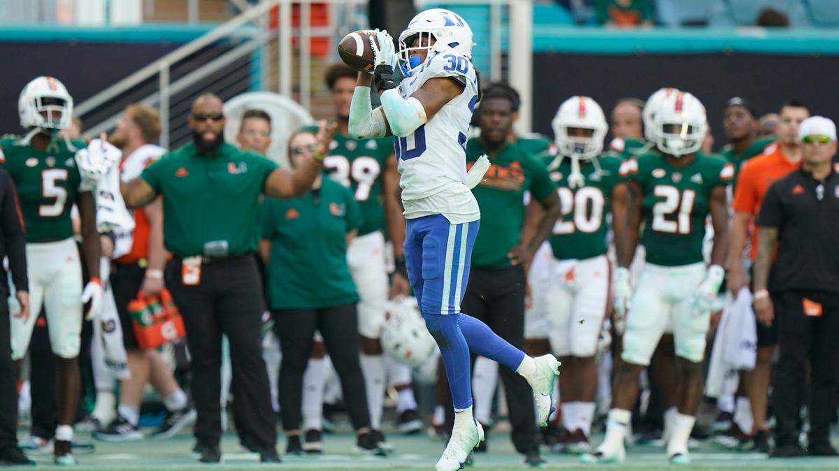 Duke defensive back Brandon Johnson intercepts a pass and runs it in for a touchdown during the second half of an NCAA college football game against Miami, Saturday, Oct. 22, 2022, in Miami Gardens, Fla. (AP Photo/Wilfredo Lee)