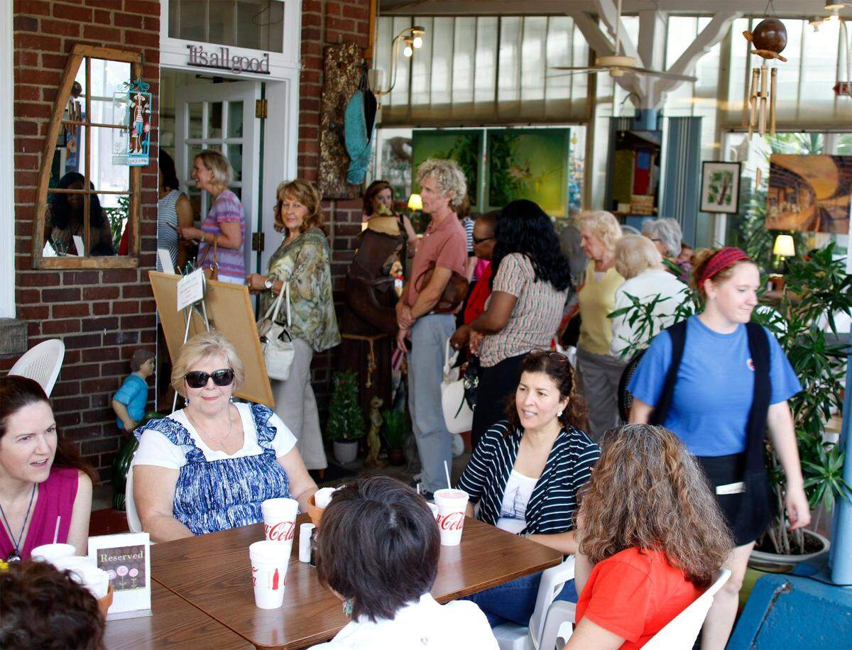 People at the Seaboard Cafe during lunch time on Wednesday, June 10, 2015 in Raleigh, NC. The popular lunch counter inside Logan’s Garden Shop closed in 2024.