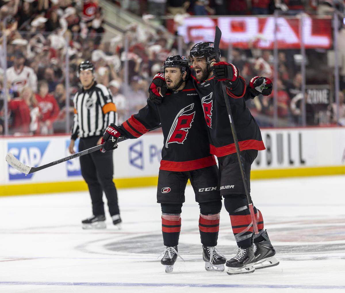 Carolina Hurricanes center Logan Stankoven (22) celebrates with teammate Shayne Gostisbehere (4) after scoring to take a 2-0 lead in the first period against Montreal during Game 5 of the Eastern Conference Finals on Friday, May 29, 2026 at Lenovo Center in Raleigh, N.C.