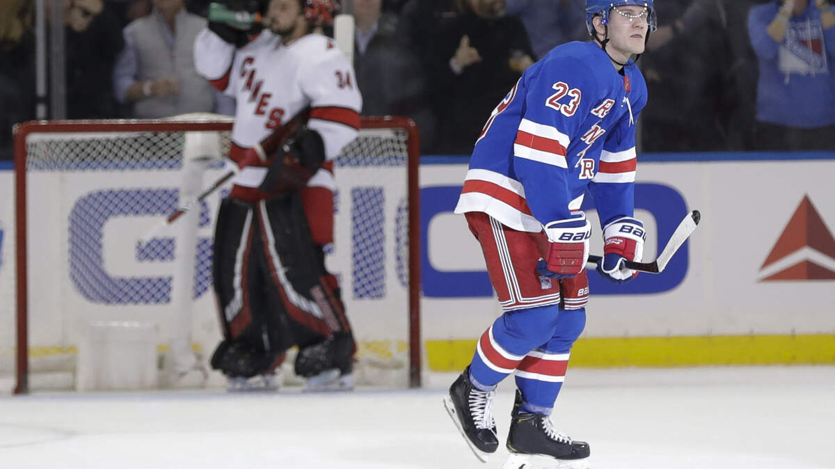 New York Rangers’ Adam Fox (23) skates past Carolina Hurricanes goaltender Petr Mrazek (34) after scoring a goal during the first period of an NHL hockey game Wednesday, Nov. 27, 2019, in New York. (AP Photo/Frank Franklin II)