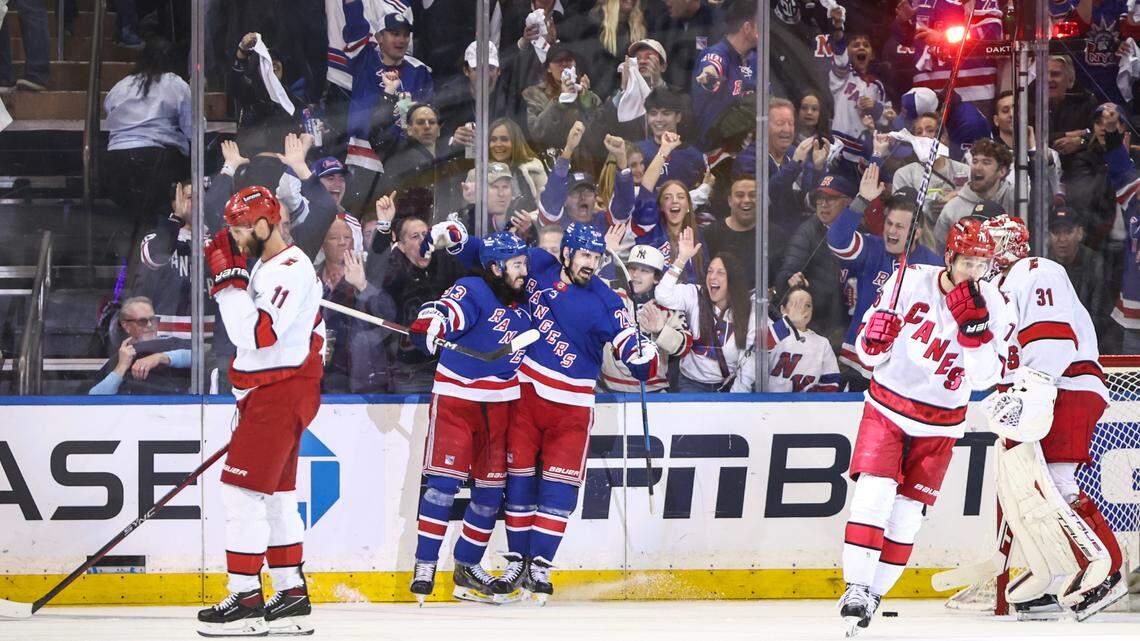 New York Rangers center Mika Zibanejad (93) celebrates with New York Rangers left wing Chris Kreider (20) after scoring his second goal of the game in the first period against the Carolina Hurricanes in game one of the second round of the 2024 Stanley Cup Playoffs at Madison Square Garden.