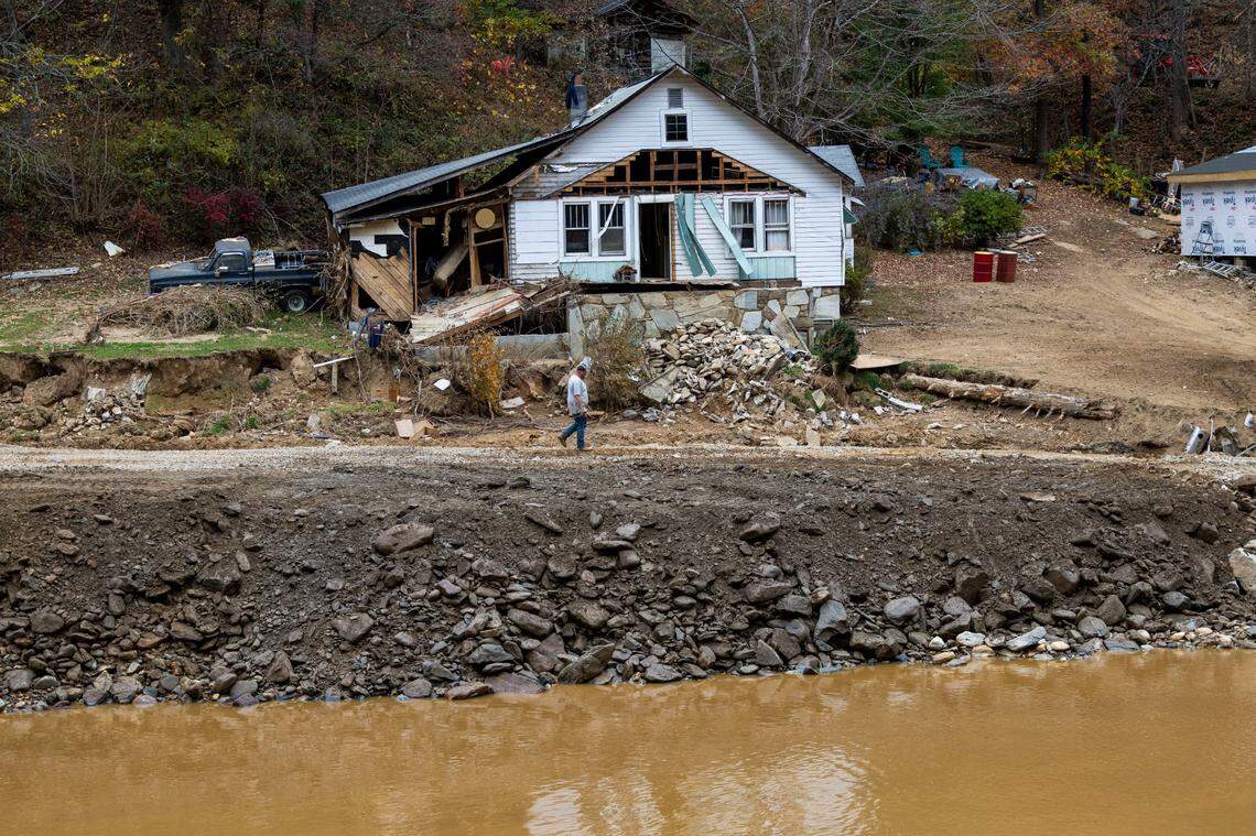 A damaged home along the Cane River near where NCDOT crews are working to repair and replace a 14-mile stretch of U.S. 19 West in Yancey County.