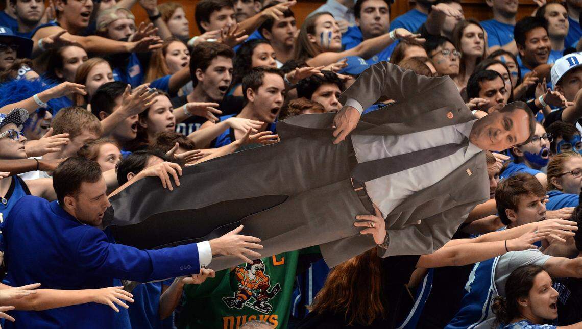 Cameron Crazies hold a cutout of Coach Mike Krzyzewski as they try to encourage the Blue Devils against N.C. State in the second half. N.C. State upset Duke 84-82 at Cameron Indoor Stadium in Durham, N.C. , Monday, Jan. 23, 2017
