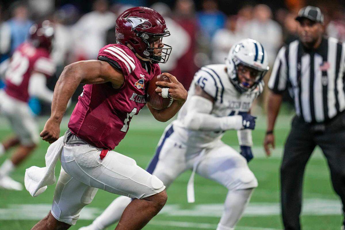 N.C. Central quarterback Davius Richard (11) runs with the ball against the Jackson State Tigers during the second half of the Celebration Bowl at Atlanta’s Mercedes-Benz Stadium.