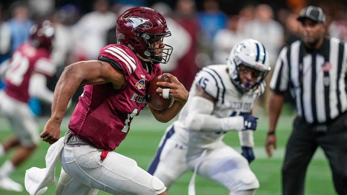 N.C. Central quarterback Davius Richard (11) runs with the ball against the Jackson State Tigers during the second half of the Celebration Bowl at Atlanta’s Mercedes-Benz Stadium.