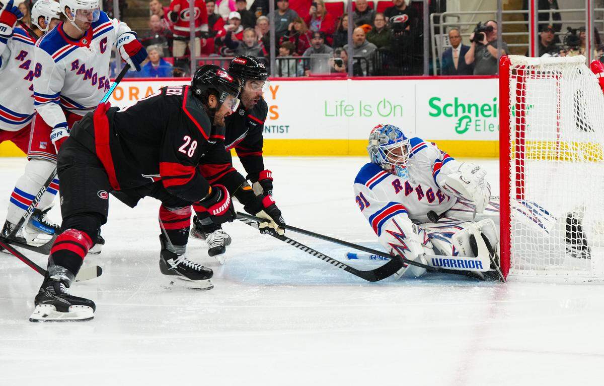 New York Rangers goaltender Igor Shesterkin (31) stops the shot attempt by Carolina Hurricanes center William Carrier (28) during the first period at Lenovo Center.