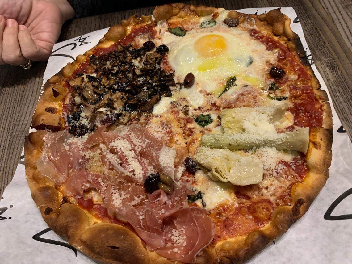 The focus at Coronato in Carrboro is Roman-style pizza. The dough includes a splash of extra virgin olive oil and is rolled very thin, yielding a crust that’s blistered and cracker-crisp at the edges. This is the Capricciosa topping combination.