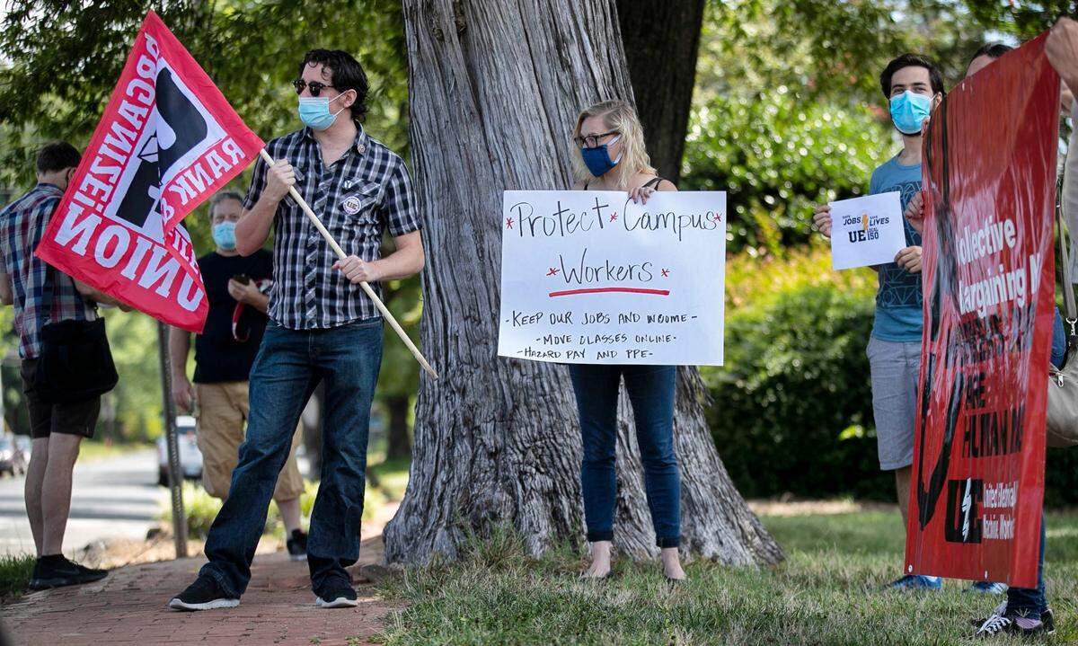 A group of protesters gathered on Cameron Avenue in Chapel Hill, N.C. on Wednesday, July 22, 2020 to present a petition to University of North Carolina officials calling for better protective equipment and protocols for workers and students amid the COVID-10 pandemic.