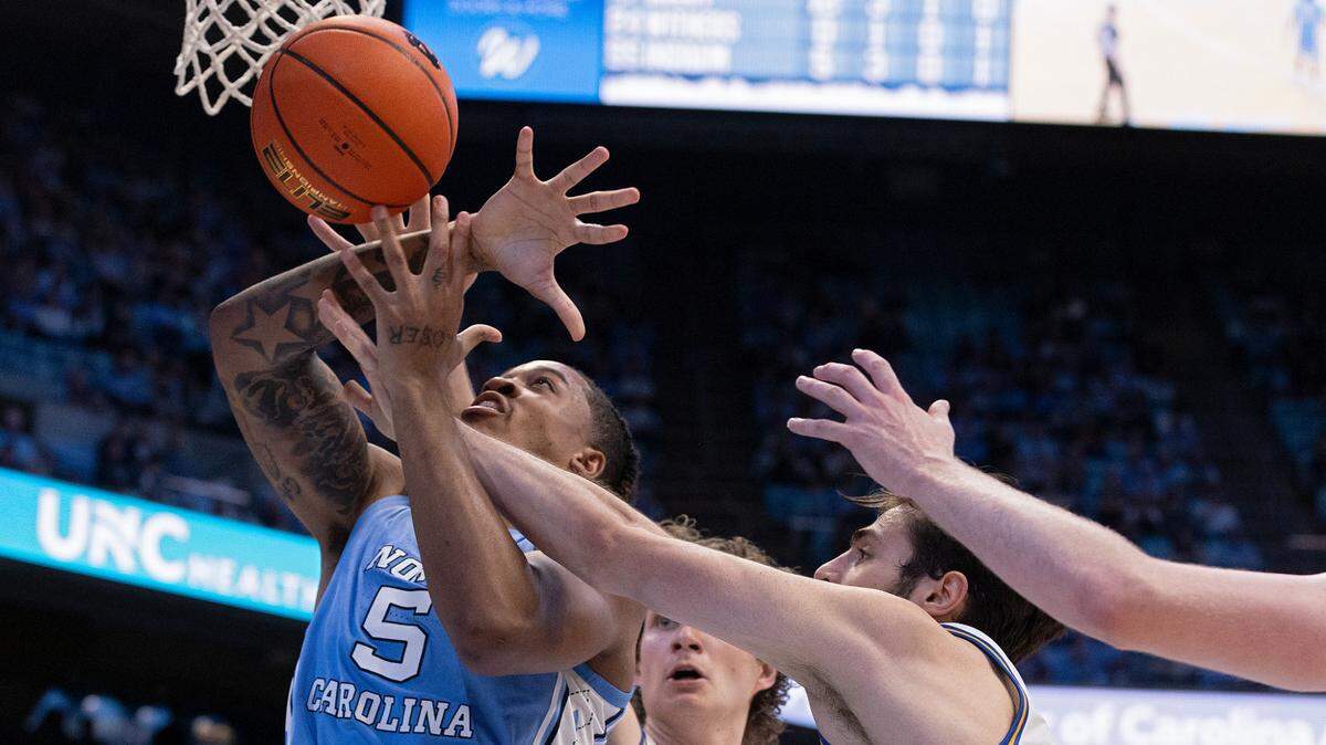 North Carolina’s Armando Bacot drives to the basket past UC Riverside’s Benjamin Griscti and Vladimer Salaridze during the first half of the Tar Heels’ 77-52 win on Friday, Nov. 17, 2023, at the Smith Center in Chapel Hill, N.C.