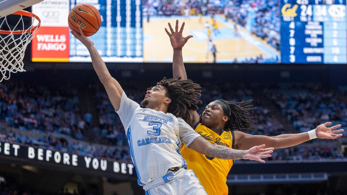 North Carolina guard Elliot Cadeau (3) breaks to the basket against Cal’s D.J. Campbell (3) in the first half on Wednesday, January 15, 2025 at the Smith Center in Chapel Hill, N.C.