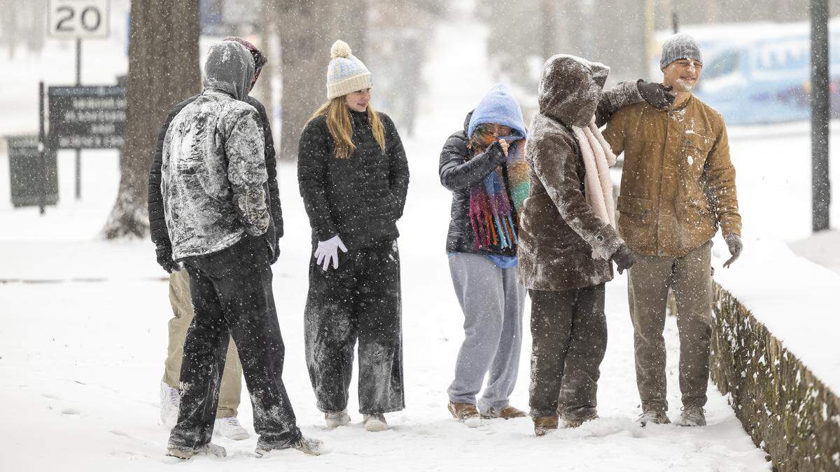 UNC-Chapel Hill students play in the snow along Franklin Street in Chapel Hill on Saturday afternoon, Jan. 31, 2026, as a winter storm brings snow and freezing temperatures to the region.