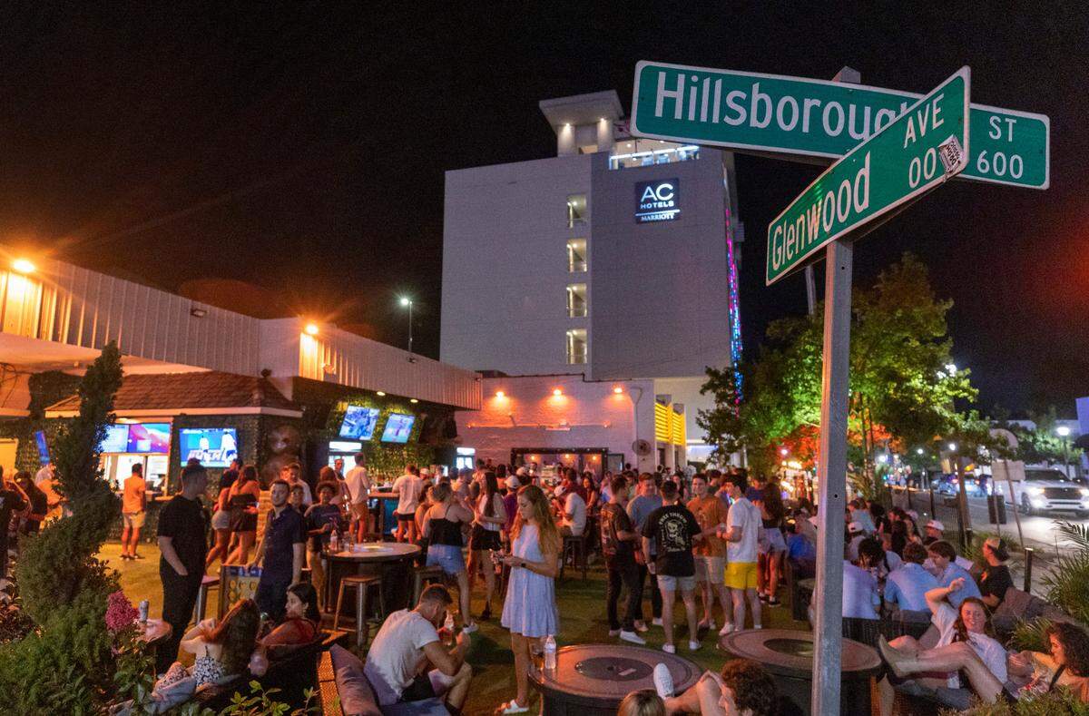 The Avenue at the corner of Glenwood Avenue and Hillsborough Street is packed on Friday July 21, 2023 in Raleigh, N.C. The popular bar located in the former Snoopy’s location has transformed the parking lot into a popular outdoor gathering spot.