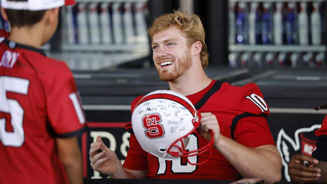 N.C. State’s Caden Fordham (10) greets fans during the Wolfpack’s Meet the Pack event at Carter-Finley Stadium Saturday, August 16, 2025.