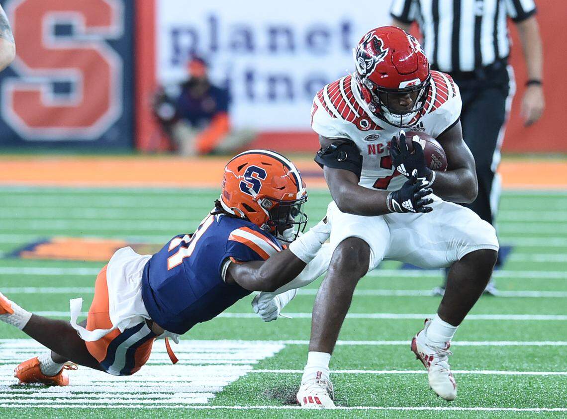 North Carolina State Wolfpack running back Zonovan Knight (7) escapes a tackle during a game against Syracuse. in the second half on Saturday, Nov. 28, 2020, at the Carrier Dome in Syracuse, N.Y.