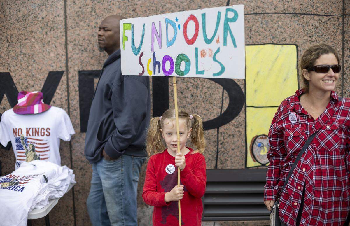 Seven-year-old Ellery Irven-Moore, of Durham, joins thousands of demonstrators on the Halifax Mall for the May Day protest  on Friday, May 1, 2026 in Raleigh, NC.