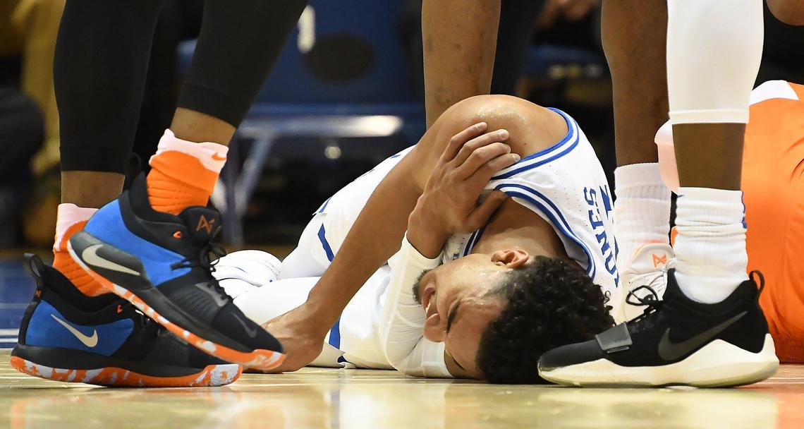 Duke guard Tre Jones (3) lays on the floor after being injured in the first half against Syracuse at Cameron Indoor Stadium In Durham, N.C. Monday, January 14, 2019. He did not return in the first half,