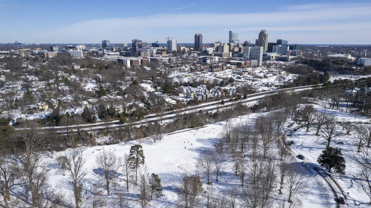 An aerial view shows snow covering much of downtown Raleigh on Sunday morning, Feb. 1, 2026. According to the National Weather Service, the winter storm from Jan. 31 to Feb. 1 brought about 2 to 3 inches of snow to Raleigh, with some areas of Wake County reporting up to 3 inches. Snowfall totals across the Triangle were generally lower than amounts reported in parts of the Piedmont and along the North Carolina coast.