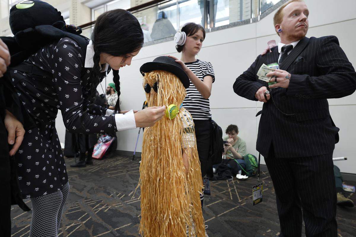 Remi Keller, 14, adjusts the costume of Phineas, 5, during GalaxyCon Raleigh at the Raleigh Convention Center Sunday, July 27, 2025.