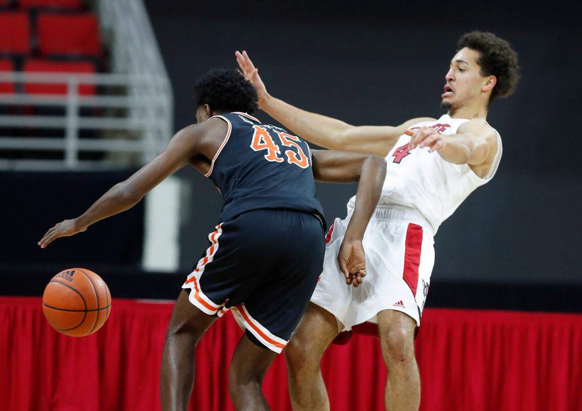 Campbell’s Cedric Henderson Jr. (45) is called for the foul for charging into N.C. State’s Jericole Hellems (4) during the second half of N.C. State’s 69-50 victory over Campbell at PNC Arena in Raleigh, N.C., Saturday, Dec. 19, 2020.