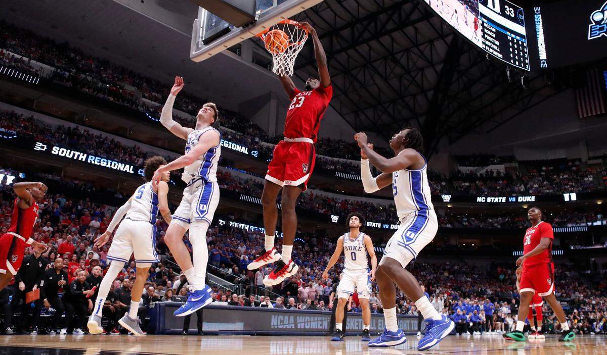 N.C. State’s Mohamed Diarra (23) slams in two during N.C. State’s 76-64 victory over Duke in their NCAA Tournament Elite Eight matchup at the American Airlines Center in Dallas, Texas, Sunday, March 31, 2024.