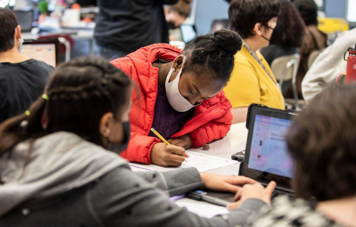 McDougle Middle School 7th grader Saniya Baldwin, 13, works on a project about African history while in her social studies class in Chapel Hill, N.C. on Friday, Feb. 18, 2022.