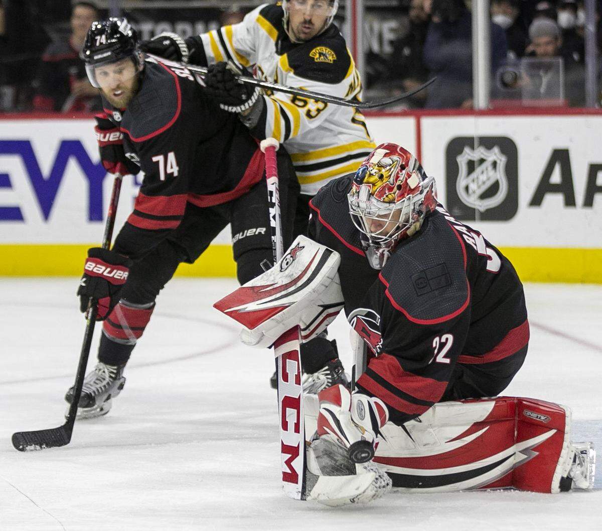 Carolina Hurricanes’ goalie Antii Raanta (32) deflects a Boston shot on goal during the first period on Saturday, May 14, 2022 during game seven of the Stanley Cup first round at PNC Arena in Raleigh, N.C.